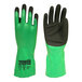 A pair of green Cordova nitrile gloves with black sandy nitrile palms.