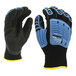 A close-up of a pair of black and blue Cordova OGRE work gloves with TPR reinforcements.