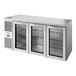 A stainless steel True back bar refrigerator with three glass doors.