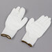 A pair of Cordova white gloves with white polyurethane palms.