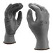 A pair of Cordova gray polyester gloves with gray palm coating.