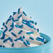 A cup of ice cream with Adourne blue sprinkles on top.