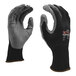 A pair of black Cordova Tactyle gloves with gray foam palms.