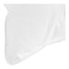 A white cloth with a stitched edge folded on a white surface.