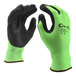 A pair of Cordova Hi-Vis lime green and black gloves with a black foam nitrile palm coating.