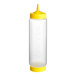 A clear plastic Vollrath Traex squeeze bottle with a yellow lid and base cap.