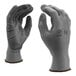 A pair of gray Cordova polyester gloves with gray palm coating.