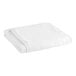A close-up of a white Garnier-Thiebaut 100% cotton lounge chair cover.