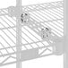 A close-up of a Lavex Pro chrome "S" hook on a wire rack.