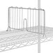 A Lavex Pro metal wire shelf divider on a metal rack.