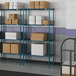 Blue Lavex Pro wire shelving with white boxes on the shelves.