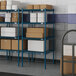 Blue Lavex Pro wire shelving with boxes on the shelves.