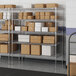 Lavex Pro metal wire shelving with boxes on the shelves.