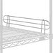 A white wire shelf with a metal bar on the edge.