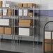 A metal Lavex Pro wire shelving unit with boxes on the shelves.