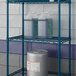 A Lavex Pro blue metal wire shelf with containers on it.