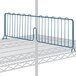 A Lavex Pro wire shelf divider with blue bars on it.