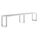 A long white rectangular metal shelf with metal poles.