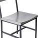 A BFM Seating gray metal chair with a black frame.