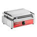 An Avantco commercial panini grill with a stainless steel body and red handle.