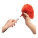 A person attaching the head of an OXO Good Grips microfiber delicate duster to its handle.