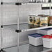 A Regency galvanized steel shelf with cans and containers.