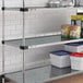 A Regency galvanized steel shelf with containers and food on it.