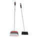 An OXO Good Grips broom and dustpan set with red and orange handles.