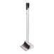 An OXO Good Grips broom with a white pole and black top.