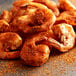 A pile of fried shrimp with Regal Bulk Bay Seafood Blend on a plate.