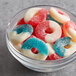 A bowl of red, white, and blue Albanese Sanded Gummi Freedom Rings.