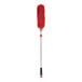 An OXO red duster with a black handle.