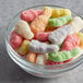 A bowl of Albanese Sanded Gummi Albunnies on a table in a hotel buffet.