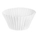 A close-up of a white paper Wilton mini baking cup with a black border.