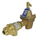 A close-up of a brass Watts combination fill valve and backflow preventer with a blue label.