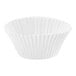 A white paper cupcake liner with a scalloped edge.