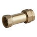 A close-up of a brass Watts 1" dual check valve.