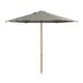 A Lancaster Table & Seating black and white striped umbrella on a wooden pole.