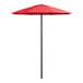 A close up of a red Lancaster Table & Seating umbrella with a black pole.