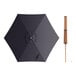 A black umbrella with a wooden handle and a wooden stick.