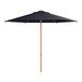 A navy blue Lancaster Table & Seating woodgrain aluminum umbrella with a wooden pole.