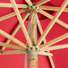 A Lancaster Table & Seating strawberry bamboo umbrella with a pulley lift.