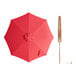 A red umbrella with a wooden pole and handle.