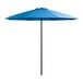 A close up of a blue Lancaster Table & Seating umbrella with a black pole.