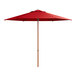 A red Lancaster Table & Seating umbrella with a woodgrain pole.