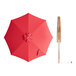 A red Lancaster Table & Seating umbrella with a wooden pole.