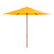 A yellow umbrella with a woodgrain pole.