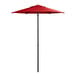 A red umbrella on a black pole.