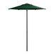 A Lancaster Table & Seating forest green umbrella on a black pole.