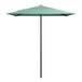 A green umbrella on a black pole.